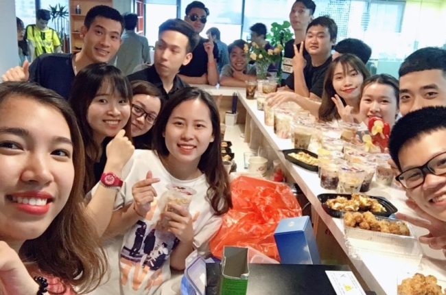 Rises team gathering around a table