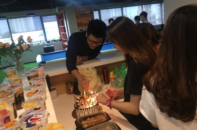 Rises team celebrating in the office